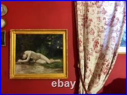 Ancienne huile sur toile du XXe siècle représentant un nu féminin, cadre doré