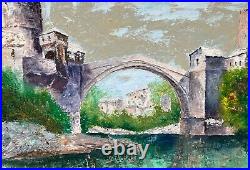 École Yugoslave Le vieux pont de Mostar Huile sur toile, signée. 41,5 x55,5 cm